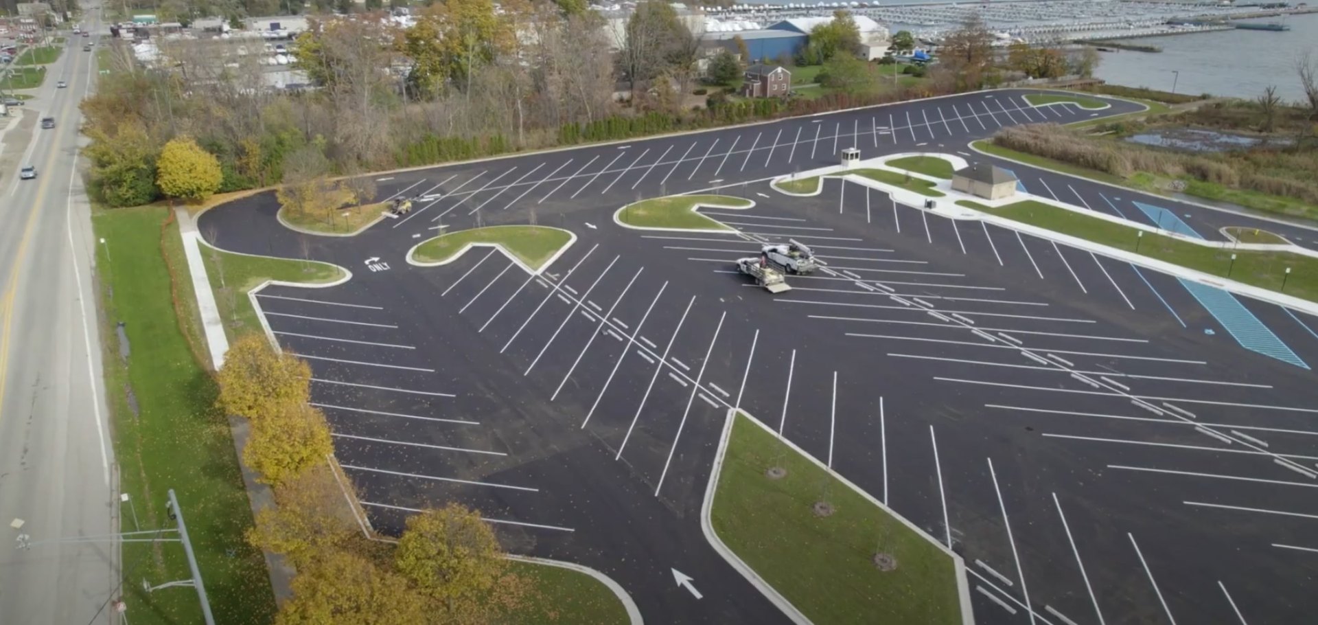 Commercial landscaping project with curved grass islands in parking lot